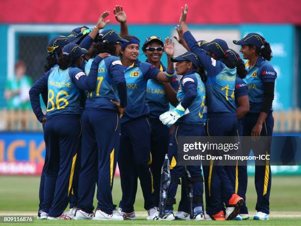 Sripali Weerakkody of Sri Lanka celebrates with team mates after taking the wicket of Punham Raut of India during the ICC Women's World Cup match...
