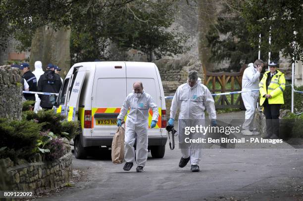 Police and forensic teams at the scene after two people died in a shooting incident in Westbury-Sub-Mendip, near Cheddar, Somerset.