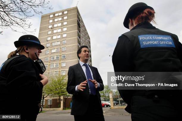 Labour Party Leader Ed Miliband meets local Police Community Support Officers during a visit to a council estate in the Collyhurst area of Manchester.