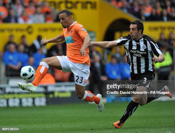 Blackpool's Matt Phillips and Newcastle United's Jose Enrique battle for the ball during the Barclays Premier League match at Bloomfield Road,...