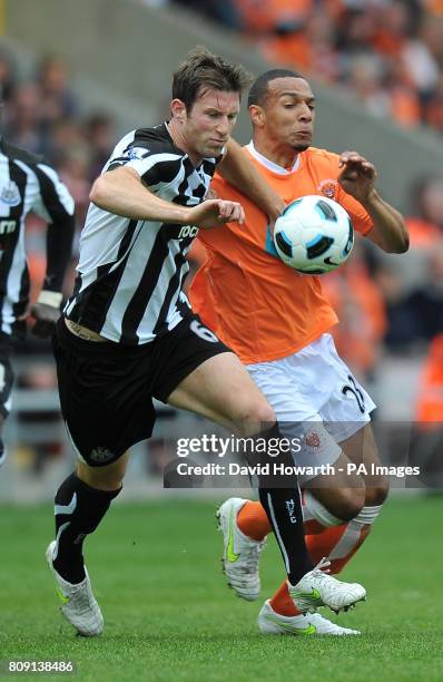 Blackpool's Matt Phillips and Newcastle United's Michael Williamson battle for the ball during the Barclays Premier League match at Bloomfield Road,...