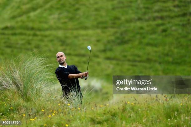 Pep Guardiola chips onto the 1st green during the Pro-Am of the Dubai Duty Free Irish Open at Portstewart Golf Club on July 5, 2017 in Londonderry,...