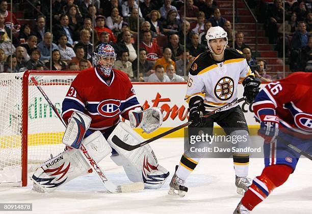 Goaltende Carey Price of the Montreal Canadiens defends his net as David Krejci of the Boston Bruins stands in the low slot area for the screen...
