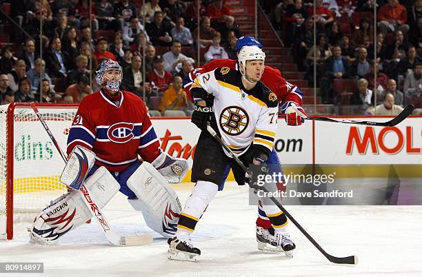 Peter Schaefer of the Boston Bruins stands in front of goaltender Carey Price of the Montreal Canadiens for the screen during game seven of the 2008...