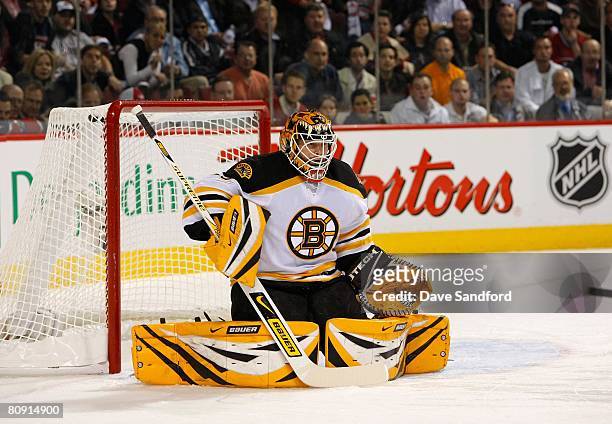 Goalkeeper Tim Thomas of the Boston Bruins defends his net against the Montreal Canadiens during game seven of the 2008 NHL Eastern Conference...