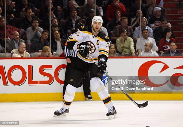 Zdeno Chara of the Boston Bruins follows through on a pass against the Montreal Canadiens during game seven of the 2008 NHL Eastern Conference...