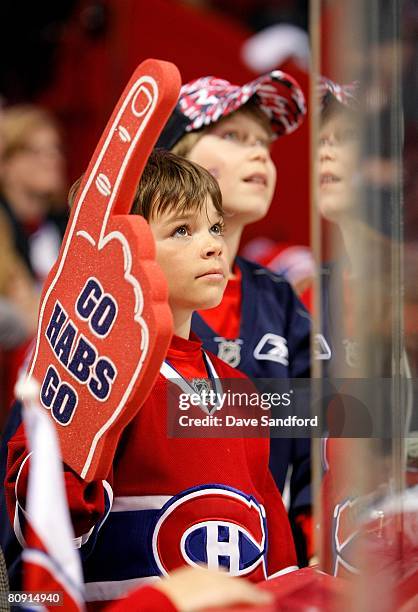 Young fan looks on during game seven of the 2008 NHL Eastern Conference Quarterfinals between the Montreal Canadiens and the Boston Bruins on April...