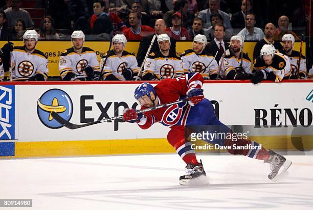 Patrice Brisebois of the Montreal Canadiens follows through on his shot from the point against the the Boston Bruins during game seven of the 2008...