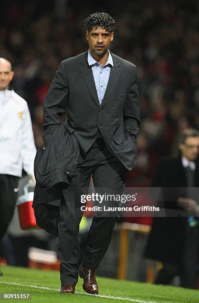 Barcelona Manager Frank Rijkaard heads for the dressing room at half time during the UEFA Champions League Semi Final, second leg match between...