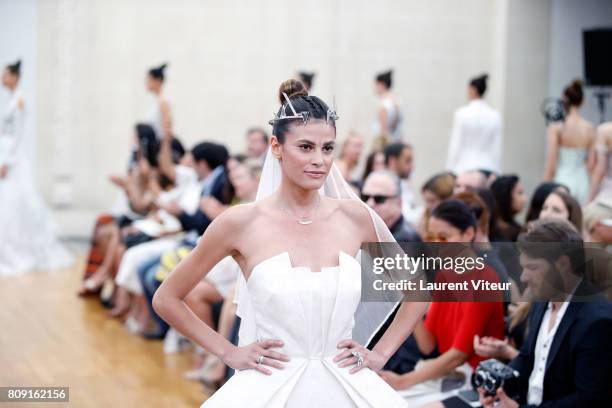 Model Alisar Ailabouni walks the runway during the Gyunel Haute Couture Fall/Winter 2017-2018 show as part of Haute Couture Paris Fashion Week on...
