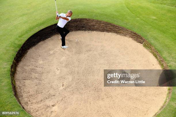 Pep Guardiola plays out of a greenside bunker on the 4th during the Pro-Am of the Dubai Duty Free Irish Open at Portstewart Golf Club on July 5, 2017...