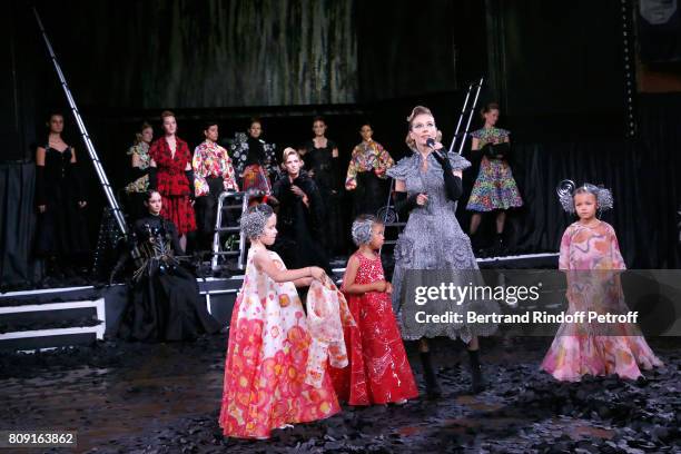 Actress Ophelia Kolb and Models children walk the runway in front of dancer Melissa Sicre, daughter of Charlelie Couture, Yamee Couture, singer Lio's...