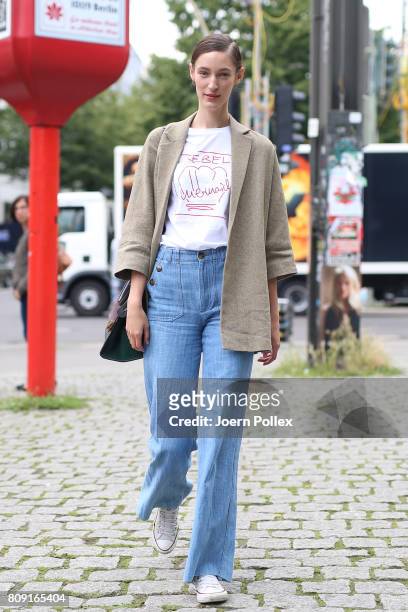 Franzi Mueller, wearing Massimo Dutti jacket, Celine bag and Malaika Raiss T-shirt, is seen during the Mercedes-Benz Fashion Week Berlin...