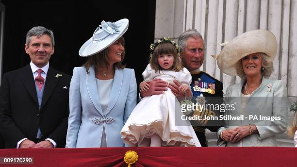 Michael Middleton, Carole Middleton, Prince Charles, holding bridesmaid Eliza Lopes and the Duchess of Cornwall, on the balcony of Buckingham Palace,...