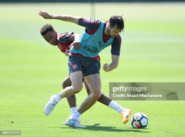 Cohen Bramall and Carl Jenkinson of Arsenal during a training session at London Colney on July 5, 2017 in St Albans, England.
