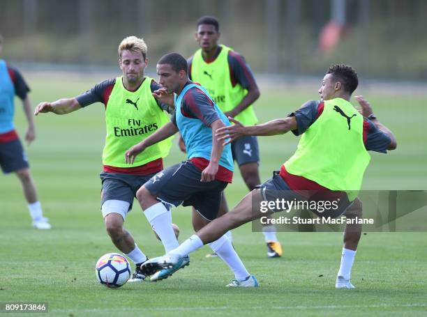 Mathieu Debuchy, Ismael Bennacer and Kieran Gibbs of Arsenal during a training session at London Colney on July 5, 2017 in St Albans, England.