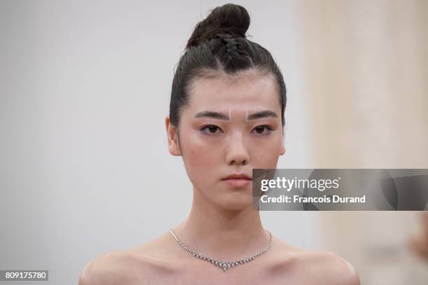 Model walks the runway during the Gyunel Haute Couture Fall/Winter 2017-2018 show as part of Haute Couture Paris Fashion Week on July 5, 2017 in...