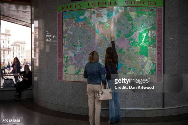 Couple look at a map of Minsk in the central train station on July 02, 2017 in Minsk, Belarus. Independence Day, also known as the Day of the...