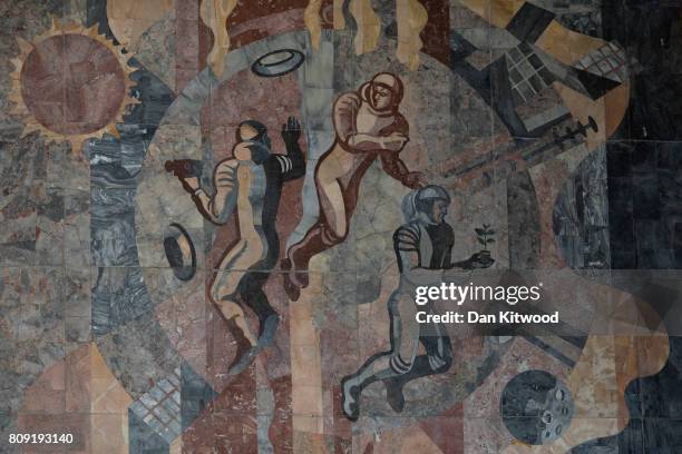 Mural above the entrance to a metro station on Independence Avenue depicts images of space exploration on July 04, 2017 in Minsk, Belarus. The...