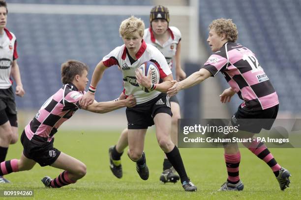 Stirling County's Archie Russell tackled by Ayr's Gavin Lowe and Danny McCluskey during Scottish Rugby's National Youth League under-16 Cup Final...