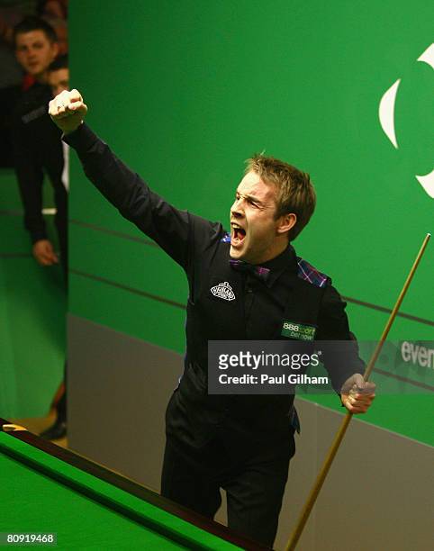 Ali Carter of England celebrates making a break of 147 against Peter Ebdon of England during the quarter finals of the 888.com World Snooker...
