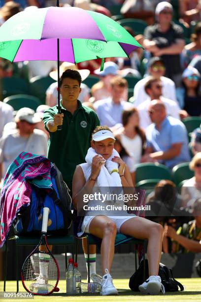 Donna Vekic of Croatia takes shade from the sun during the Ladies Singles second round match against Johanna Konta of Great Britain on day three of...