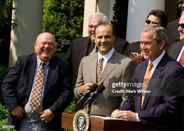 New York Yankee manager Joe Torre, center, and coach Don Zimmer, left, laugh at a joke by U.S. President George W. Bush, right, May 4, 2001 in the...