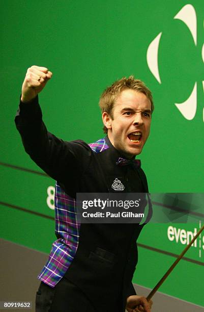 Ali Carter of England celebrates making a break of 147 against Peter Ebdon of England during the quarter finals of the 888.com World Snooker...