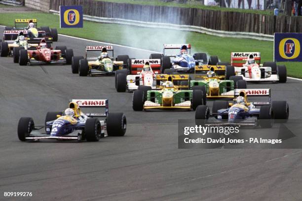 Nigel Mansell in the Williams-Renault , briefly behind teammate Riccardo Patrese at Copse, on his way to winning the British Grand Prix. Great...