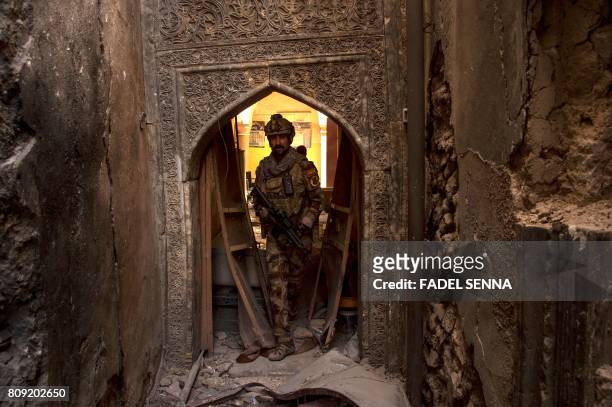 Member of Iraq's Counter-Terrorism Service advances in the Old City of Mosul on July 5 during the government forces' ongoing offensive to retake the...