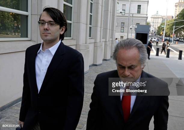 Martin Shkreli, former chief executive officer of Turing Pharmaceuticals AG, left, arrives at federal court with his attorney Benjamin Brafman in the...