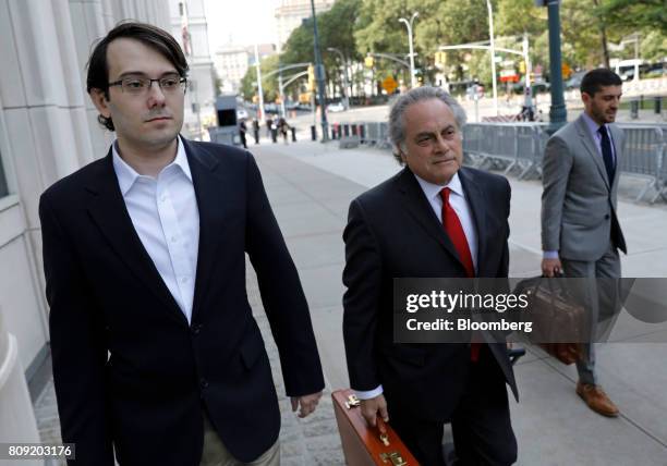 Martin Shkreli, former chief executive officer of Turing Pharmaceuticals AG, left, arrives at federal court with his attorney Benjamin Brafman in the...