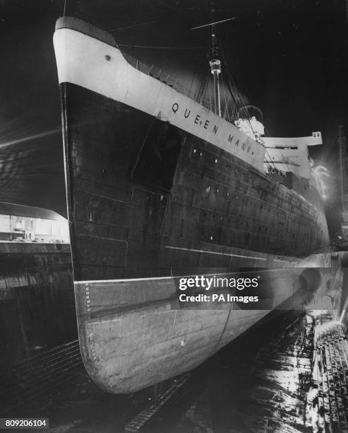 The giant Cunard-White Star liner RMS Queen Mary in the King George V dry dock at Southampton, for her annual inspection.