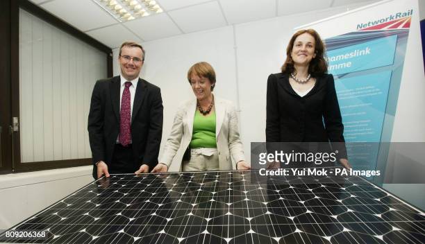 Environment Secretary Caroline Spelman , Rail Minister Theresa Villiers and Network Rail Director of Investment Projects Simon Kirby holding one of...