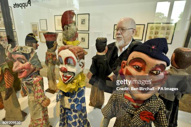Peter Blake stands beside a collection of puppets in his exhibition, titled 'A Museum for Myself', in the newly refurbished Holburne museum, Bath,...