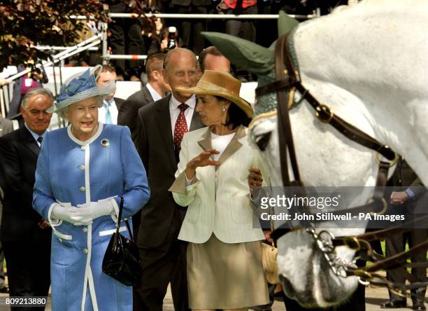 Queen Elizabeth II and the Duke of Edinburgh follow Lady Chryss O'Reilly during a visit to the Irish National Stud, one of Ireland's top...