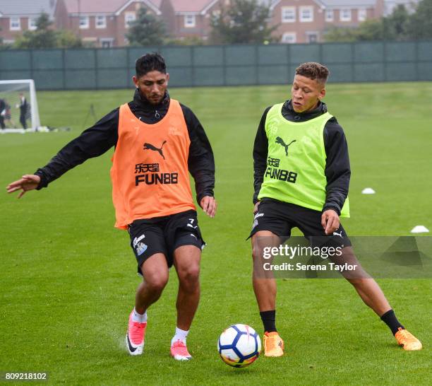 Achraf Lazaar and Dwight Gayle challenge for possession of the ball during the Newcastle United Training session at the Newcastle United Training...