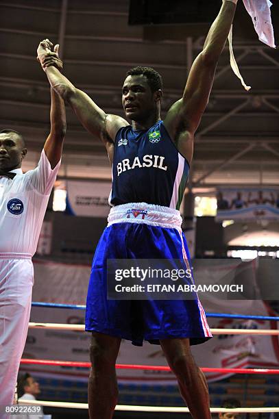 Brazil's boxer Hamilton Ventura da Conceicao celebrates after defeating Canada's Lois Sylveira-Jaques during their Final Americas Olympic Qualifier...