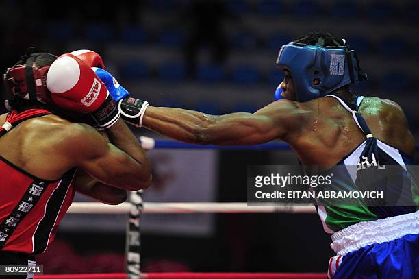 Canada's boxer Lois Sylveira-Jaques exchanges blows with his Brazilian rival Hamilton Ventura da Conceicao during their Final Americas Olympic...