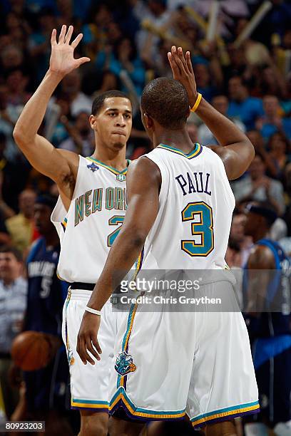 Chris Paul and Jannero Pargo of the New Orleans Hornets celebrate during the game against the Dallas Mavericks in Game Five of the Western Conference...