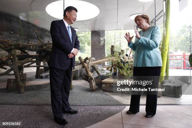 German Chancellor Angela Merkel and Chinese President Xi Jinping officially open the new panda enclosure for viewing at Zoo Berlin on July 5, 2017 in...