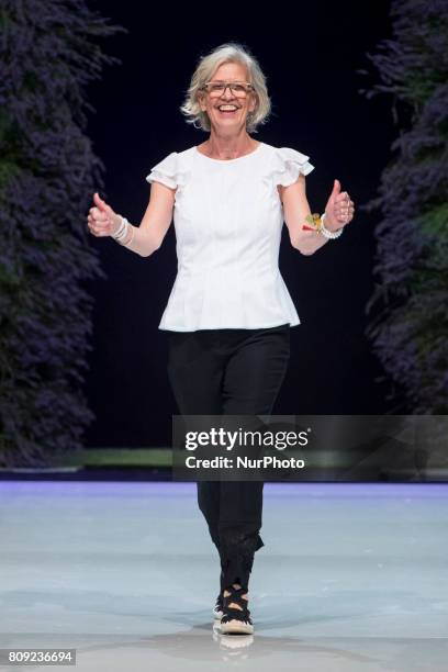 Designer Karin Veit acknowledges the applause of the guests at the end of Marc Cain Spring/Summer 2018 fashion show at E-Werk in Berlin, Germany on...