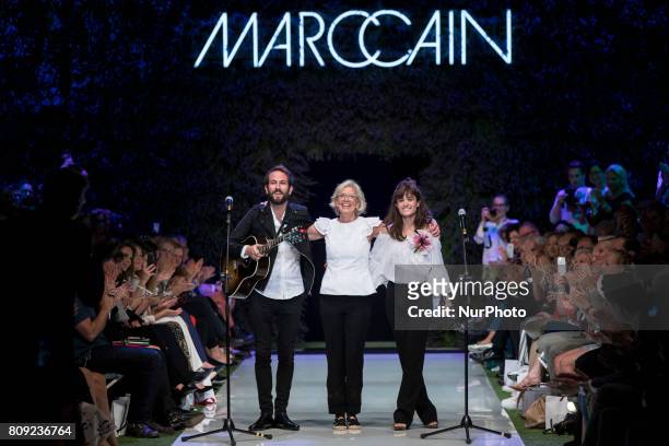 Designer Karin Veit acknowledges the applause of the guests at the end of Marc Cain Spring/Summer 2018 fashion show at E-Werk in Berlin, Germany on...