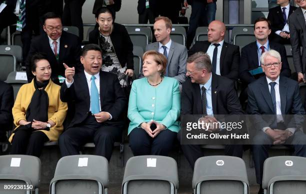 President Reinhard Grindel , President XI Jinping of China , German Chancellor Angela Merkel and Reinhard Rauball , President of German Football...