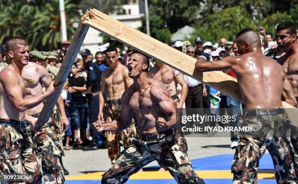 Members of the Algerian Special Forces demonstrate their martial arts skills as they perform by the Army Museum at the Esplanade of Ryad el-Feth on...