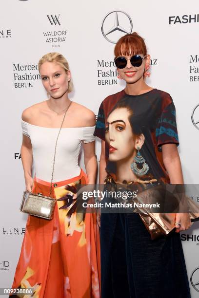 Model Kim Hnizdo and Sussan Zeck attend the Rebekka Ruetz show during the Mercedes-Benz Fashion Week Berlin Spring/Summer 2018 at Kaufhaus Jandorf on...