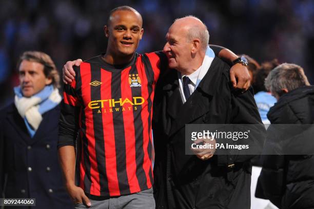 Manchester City's Vincent Kompany and life president Bernard Halford during the Manchester City FA Cup Victory Parade at the City of Manchester...