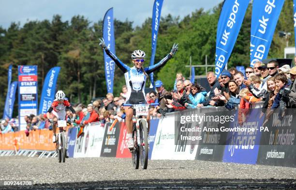 France's Pauline Ferrand Prevot celebrates winning the Women's Under 23 Elite Cross Country Olympic 2 Mountain Bike World Cup event at Dalby Forest,...