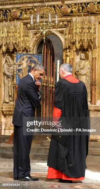 President Barack Obama speaks with the Dean of Westminster Dr John Hall, during a tour of Westminster Abbey, in central London, as part of his...