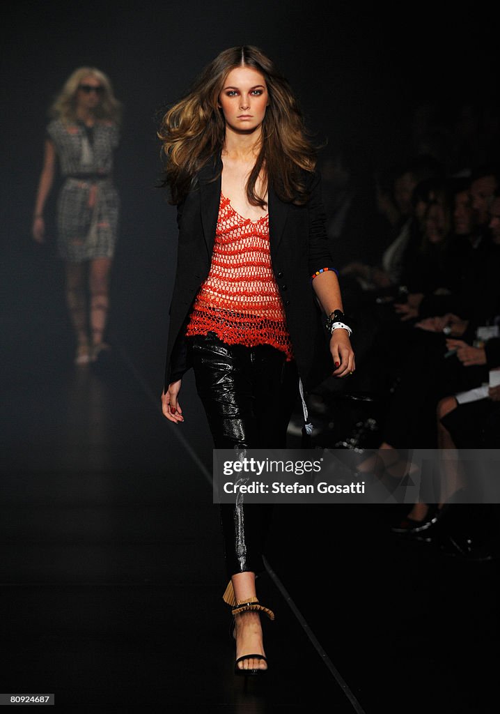 A model showcases an outift by designer Ginger & Smart on the catwalk ...